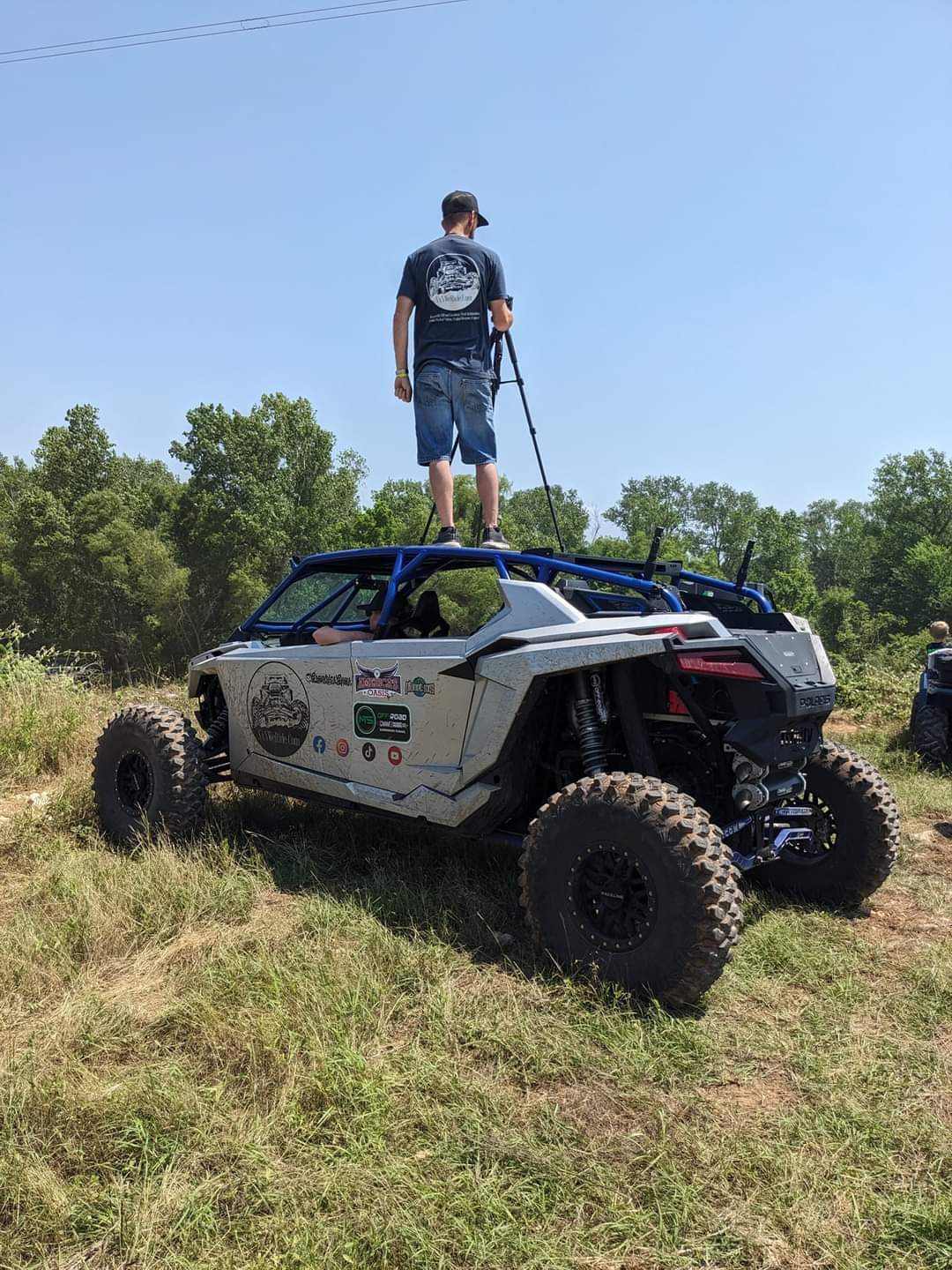 SxSWeRide founder filming off road event coverage from a side by side